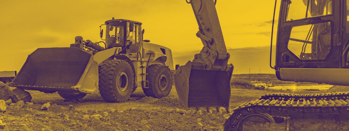 Loader and Excavator on work site with yellow overtone
